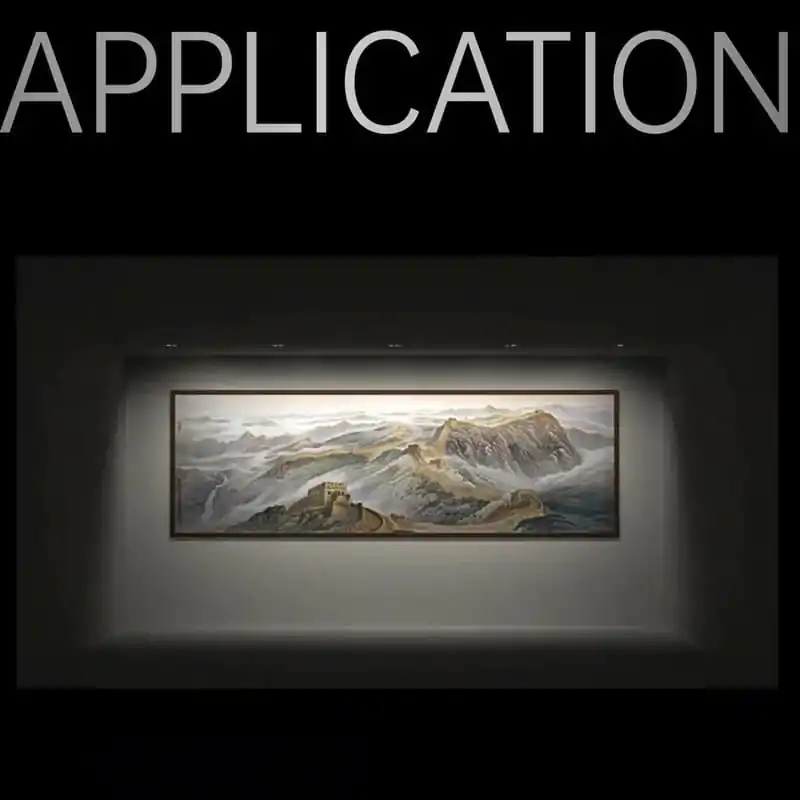 High-quality professional art gallery lighting illuminating a landscape painting.